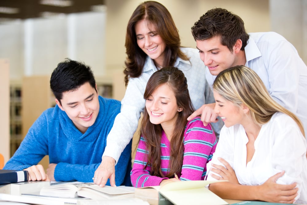 Study group at the library with the teacher